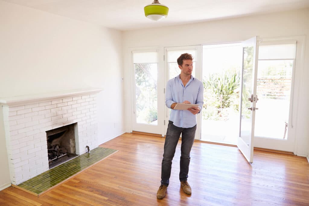 Man holding tablet during HMO fire risk assessment