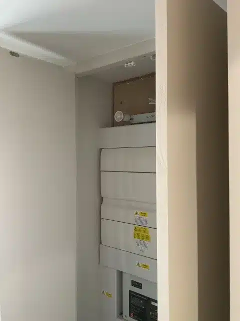 Consumer units within the existing service cupboard.